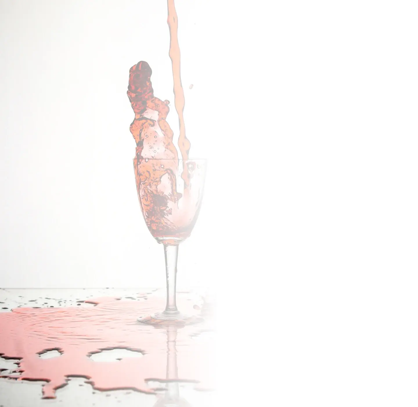 wine splashing out of cup